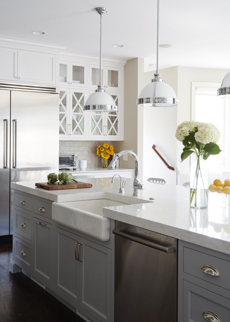 Neutral Stainless Kitchen Complemented by Textured Tilework